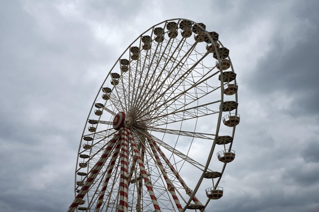 Ferris wheel under cloudy sky